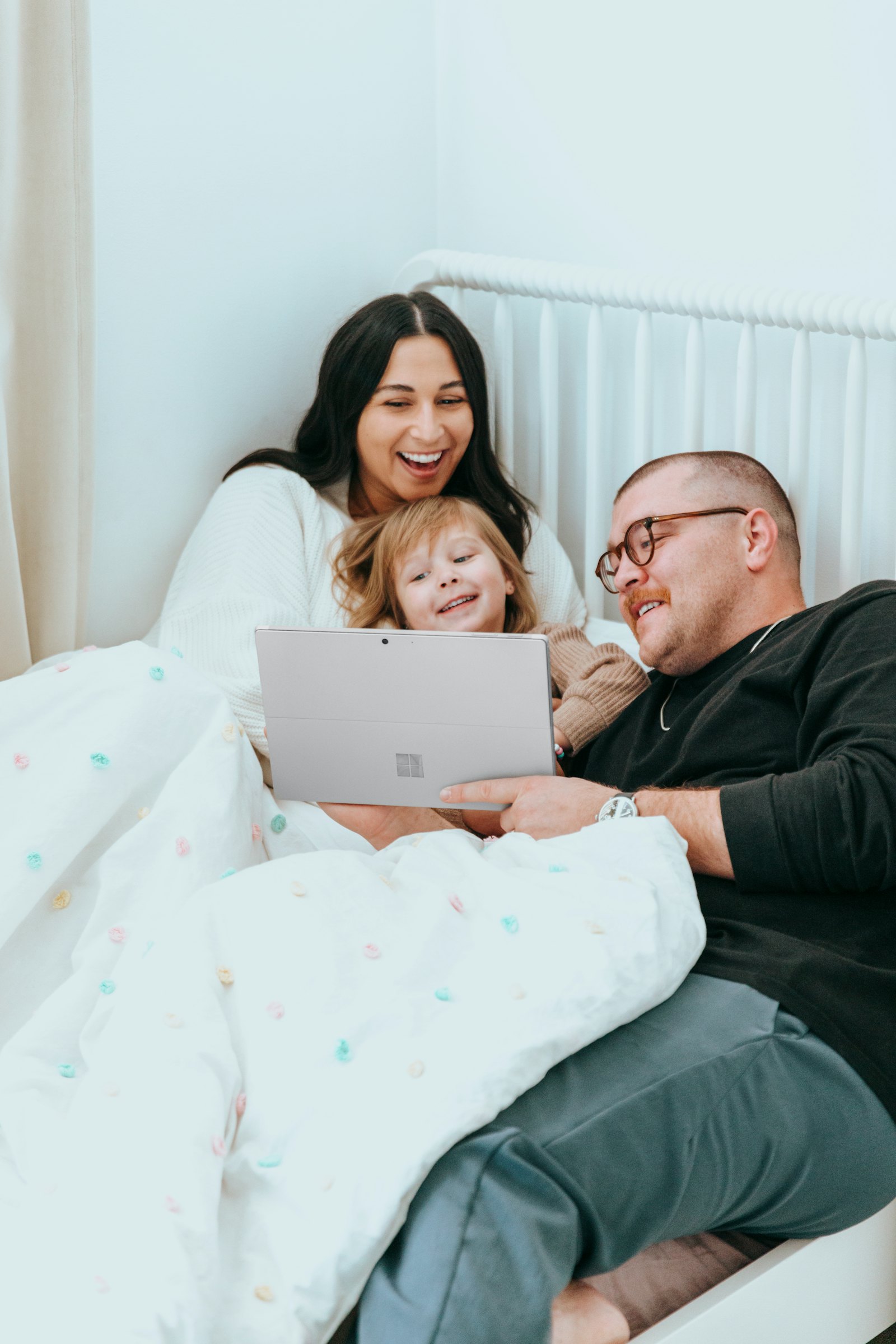 Temporary comp image of a household reviewing information on a laptop.